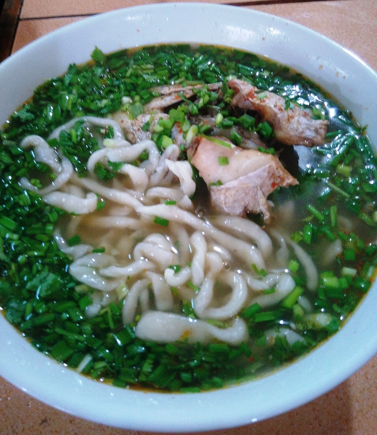 Dong Ha snakehead fish porridge — A bowl of "bed sheet" noodle soup rich in hometown flavor. - 2