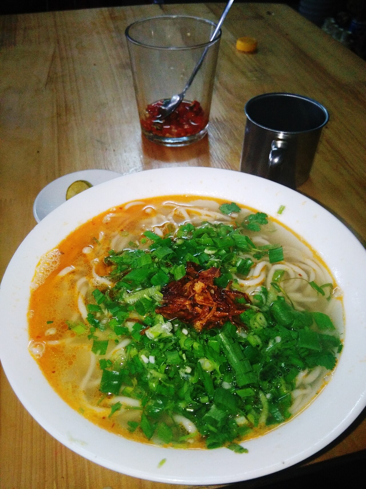 Dong Ha snakehead fish porridge — A bowl of "bed sheet" noodle soup rich in hometown flavor. - 1