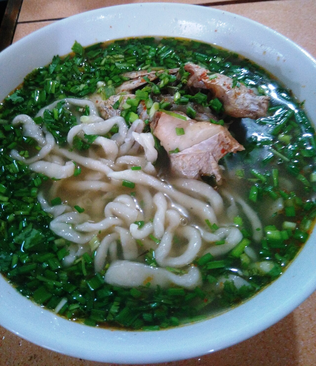 Dong Ha snakehead fish porridge — A bowl of "bed sheet" noodle soup rich in hometown flavor. - ảnh 6